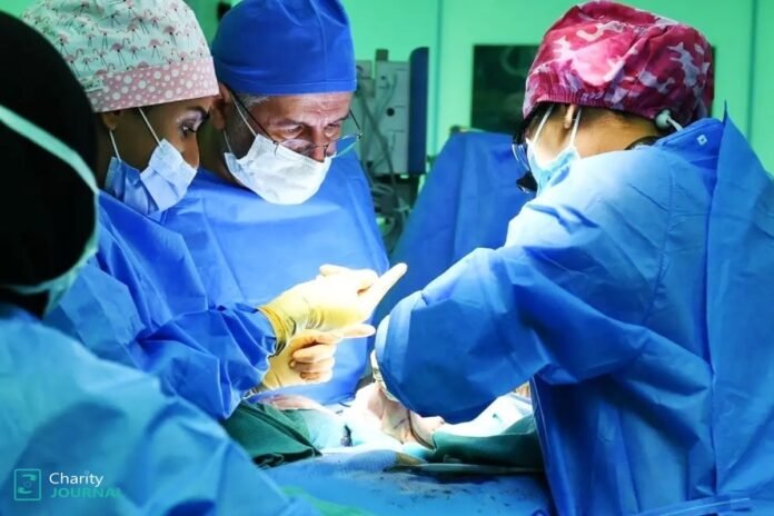Surgeons working inside an operating theatre