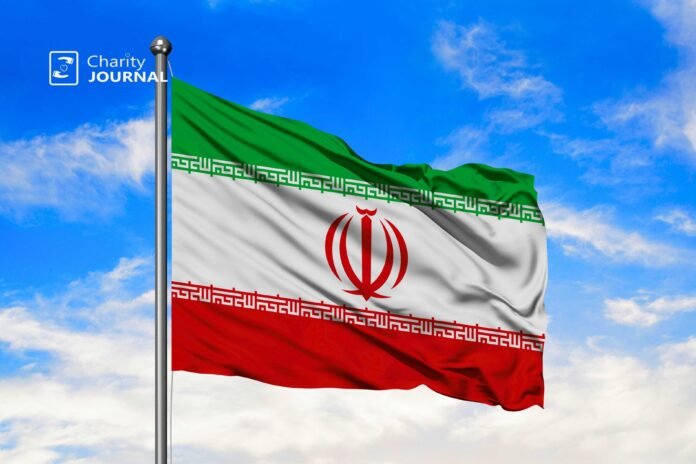 Horizontal green, white, and red flag of Iran with the red national emblem centred on the white stripe