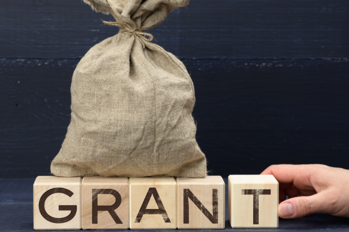 A sack sitting on wooden block of letters with 