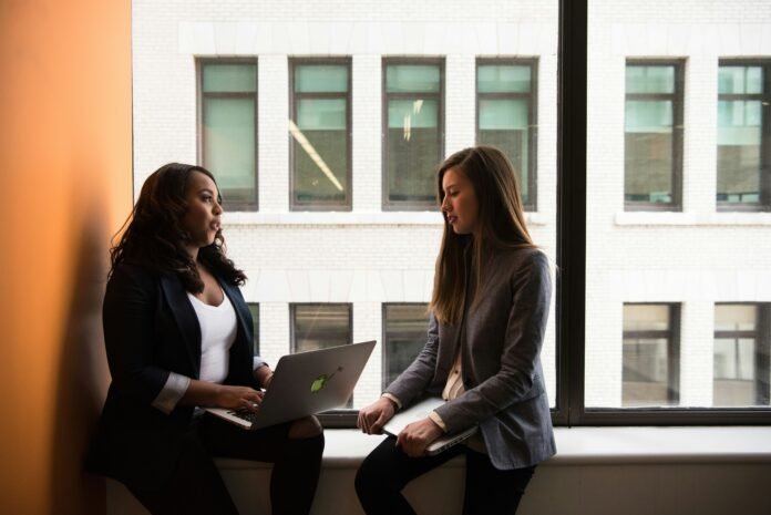 Two women talking to represent Kitty Fund Grant 2026