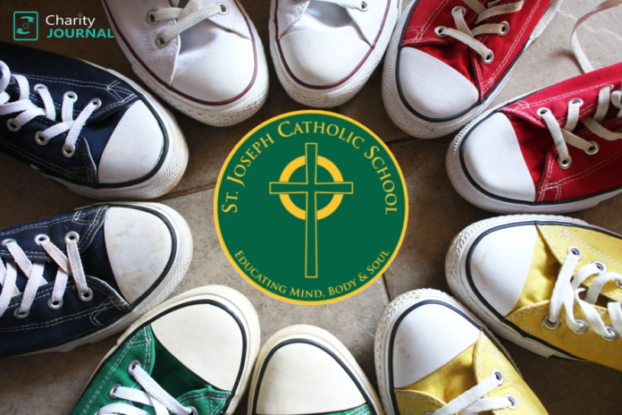 Pairs of colorful sneakers arranged in a circle around St. Joseph Catholic School logo