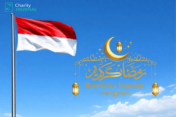 The Indonesian flag waving against a blue sky with a 