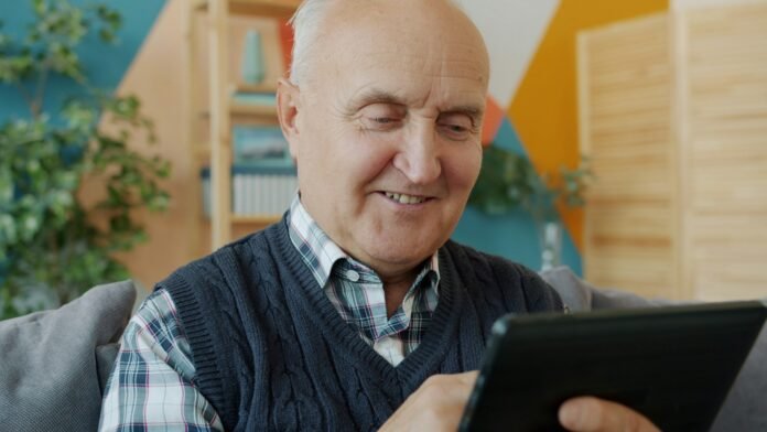 Senior citizen using a tablet reflecting digital inclusion