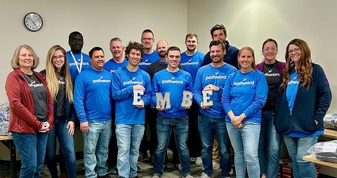 Embe volunteers with Pathward staff