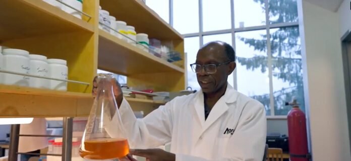 AGRO-100 scientist testing new biostimulant in lab
