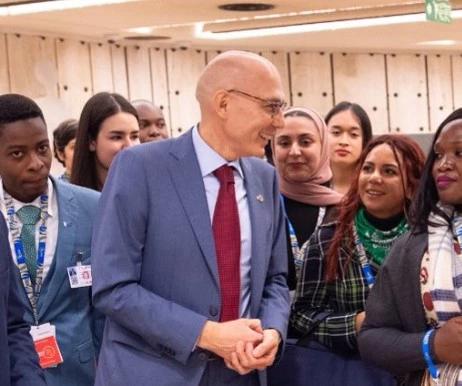Volker Türk surrounded by UN staff