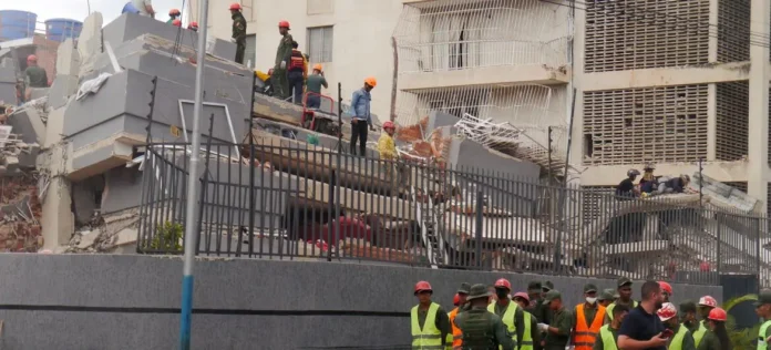 Rescue workers evaluate damage in Palos Grandes, Caracas, following the June 24th earthquakes in Venezuela.